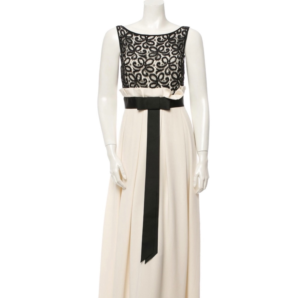 This stunning white silk Marchesa Notte sleeveless gown is the perfect addition